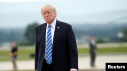 FILE - President Donald Trump boards Air Force One as he departs Hagerstown, Maryland, Aug. 18, 2017. 