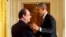 French President Francois Hollande shakes hands with President Barack Obama after their joint news conference in the East Room of the White House, Feb. 11, 2014.