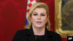 FILE - Croatia's President Kolinda Grabar-Kitarovic addresses the media after her talks with Austrian President Heinz Fischer at the Hofburg palace in Vienna, Austria, June 18, 2015. 