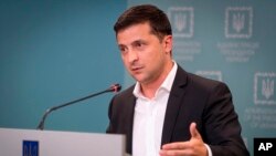 Ukrainian President Volodymyr Zelenskiy speaks to media during his press conference in Kyiv, Ukraine, Oct. 1, 2019. 