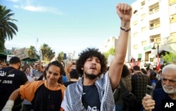 Tunisians protest against President Kais Saied ahead of the upcoming presidential elections, Sept. 13, 2024, in the capital of Tunis.