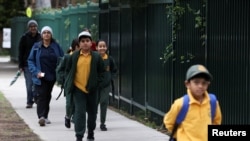 Children return to campus for the first day of New South Wales public schools fully re-opening for all students and staff amidst the easing of the coronavirus disease (COVID-19) restrictions at Homebush West Public School in Sydney, May 25, 2020.