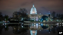 The U.S. Capitol is seen at night after negotiators sealed a deal for COVID relief, Dec. 20, 2020, in Washington.