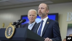 FILE - Brownsville, Texas, Mayor John Cowen is shown with President Joe Biden on Feb. 29, 2024. Cowen is headed to Washington on June 4, when Biden is expected to announce his latest and most aggressive plan to curtail the number of migrants allowed to seek asylum in the U.S. 