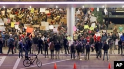 Hundreds of people opposed to President Donald Trump's executive orders barring entry to the U.S. of seven predominantly Muslim countries demonstrate at the Tom Bradley International Terminal at Los Angeles International Airport, Jan. 28, 2017. 