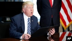 President Donald Trump speaks before signing an executive order at the Treasury Department in Washington, April 21, 2017.