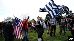 Members of the Proud Boys and other right-wing demonstrators rally, Sept. 26, 2020, in Portland, Ore. 