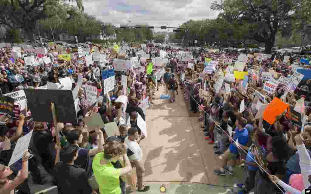 Students gather on the steps of the old Florida Capitol protesting gun violence in Tallahassee, Fla., Feb. 21, 2018. 