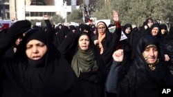 Iranian protesters chant slogans at a rally in Tehran, Iran, Dec. 30, 2017. Iranian hard-liners rallied Saturday to support the country's supreme leader and clerically overseen government as spontaneous protests sparked by anger over the country's ailing 