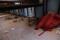 FILE - School bags and supplies belonging to pupils at the Government Science School are seen on the floor where gunmen abducted students, in Kankara, in northwestern Katsina state, Nigeria, Dec. 15, 2020.
