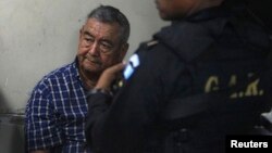 FILE - Suspect Waldemar Lorenzana Lima (L) sits after his arrest in Guatemala City, April 26, 2011. 