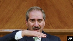 Jordan's Foreign Minister Nasser Judeh speaks to the media after his meeting with Israeli and Palestinian negotiators alongside international mediators trying to revive their stalled peace talks after more than a year of deadlock in Amman, January 3, 2012