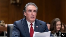 Former Gov. Doug Burgum, President-elect Donald Trump's choice to lead the the Interior Department as Secretary of the Interior, testifies before the Senate Energy and Natural Resources Committee on Capitol Hill in Washington, Jan. 16, 2025. 