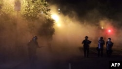 Police hold a perimeter near the White House as demonstrators gather in the morning hours on May 31, 2020 in Washington, DC. 