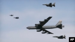 A U.S. Air Force B-52 bomber flies over Osan Air Base in Pyeongtaek, South Korea, Jan. 10, 2016. The bomber flew low over South Korea on Sunday, a show of force from the U.S. as a Cold War-style standoff deepened between ally Seoul and North Korea.