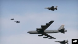 FILE - A U.S. Air Force B-52 bomber flies over Osan Air Base in Pyeongtaek, South Korea, Jan. 10, 2016. 