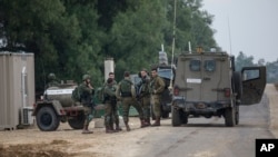 Israeli soldiers stand near the southern Israel-Gaza border, Nov. 12, 2018. Calm returned to the border after an Israeli special forces operation led to clashes that left eight people dead. 