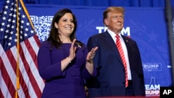 FILE - Donald Trump and Rep. Elise Stefanik are seen at a campaign event in Concord, New Hampshire, Jan. 19, 2024.