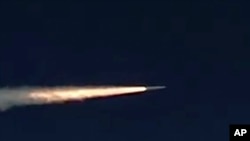 FILE - In this photo made from footage taken from the Russian Defense Ministry website, March 11, 2018, a Russian Kinzhal hypersonic missile flies during a test in southern Russia.