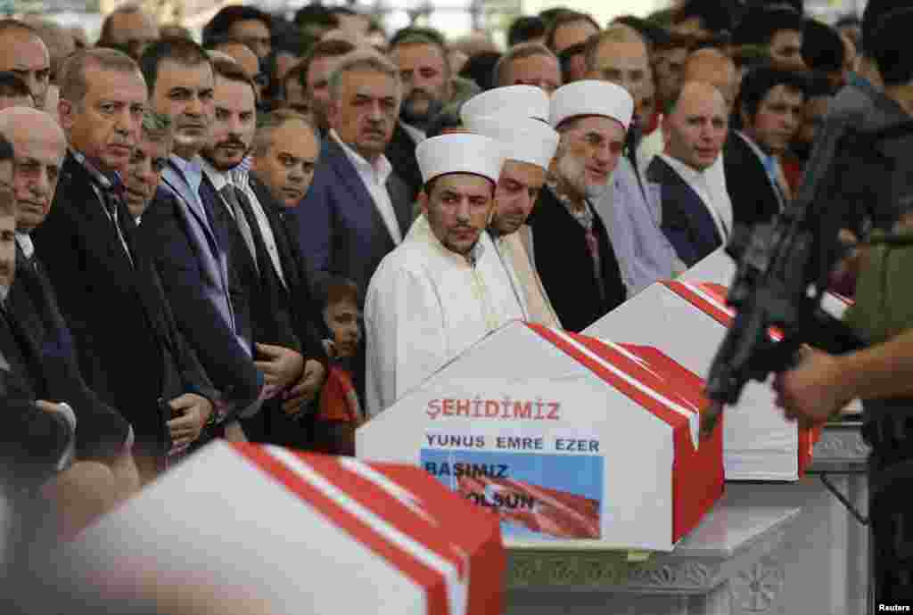 urkish President Recep Tayyip Erdogan (L) attends a funeral service for a victim of the thwarted coup in Istanbul at Fatih mosque in Istanbul, July 17, 2016.