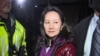 FILE - This TV image provided by CTV to AFP shows Huawei Technologies Chief Financial Officer Meng Wanzhou as she exits the court registry following the bail hearing at British Columbia Superior Courts in Vancouver, British Columbia, Dec. 11, 2018.