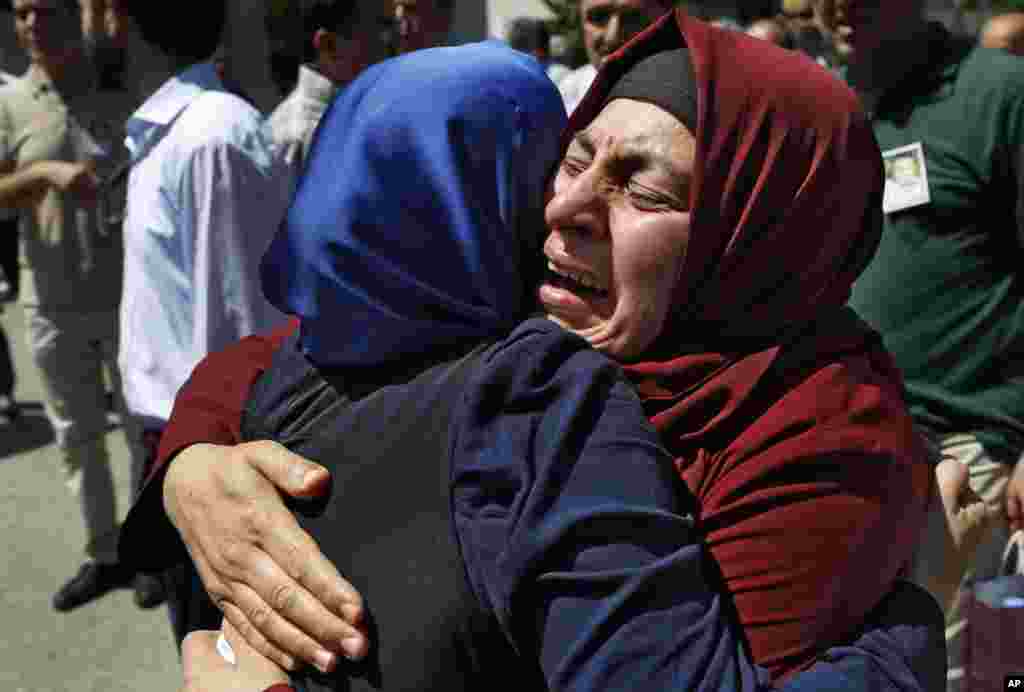 Relatives of Turkish geologist Cuma Dag, 39, who was killed by helicopter gunfire last Friday while protesting against the attempted military coup, mourn during his funeral in Ankara, July 17, 2016.