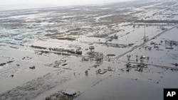 State Highway 27 leading to Cameron, La. is seen in Creole, La., Aug. 28, 2020, as the storm surge recedes in the aftermath of Hurricane Laura.
