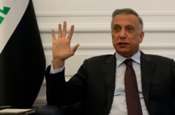 Iraqi Prime Minister Mustafa al-Kadhimi speaks during an interview with The Associated Press in Baghdad, Iraq, Aug. 17, 2020.