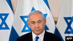 FILE - Israeli Prime Minister Benjamin Netanyahu looks on during a briefing at Hakirya military base in Tel Aviv, May 19, 2021. 