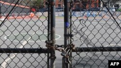 The gate at Public School 39 is closed with a lock on March 16, 2020 in the Brooklyn Borough of New York City. Mayor Bill de Blasio said on July 31, 2020, that NYC schools hope to reopen in September.