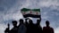 Syrians gather in celebration days after the fall of Bashar al-Assad's government at Umayyad Square in Damascus, Dec. 12, 2024. 
