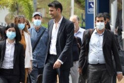 Al Jazeera staff leave Bukit Aman police headquarters after being questioned by the Malaysian police over a documentary about the country’s arrests of undocumented migrants, in Kuala Lumpur, Malaysia July 10, 2020.