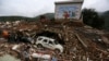 Rescuers and residents search for survivors among debris of collapsed buildings after an earthquake hit Longtoushan township of Ludian county, Yunnan province, Aug. 4, 2014. 