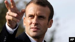 French President Emmanuel Macron arrives at the Trottoir necropolis in Les Eparges, eastern France, Nov. 6, 2018, as part of the ceremonies marking the centenary of the end of World War I. 