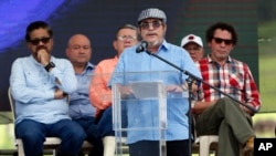 Rodrigo Londono, seen in this June 27 file photo, is also known as Timoleon Jimenez or Timochenko, the top commander of the Revolutionary Armed Forces of Colombia, FARC, gives his speech during an act to commemorate the completion of the disarmament process of FARC rebels, in Buenavista, Colombia. On Sunday, July 2, 2017, Timochenko was hospitalized with stroke, and remains in intensive care in Colombia. 