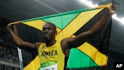 FILE - Usain Bolt from Jamaica celebrates after winning the gold medal in the men's 200-meter final during the 2016 Summer Olympics in Rio de Janeiro, Brazil.
