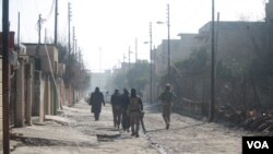 Indigenous Anangu children play with a camera during a ceremony marking the permanent ban on climbing Uluru, also known as Ayers Rock, at Uluru-Kata Tjuta National Park in Australia's Northern Territory.