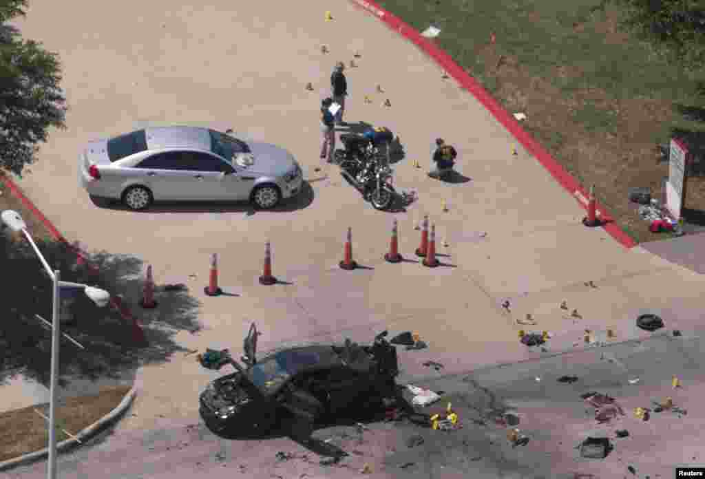 An aerial view shows a car that was used the previous night by two gunmen, who were killed by police, as it is investigated by local police and the FBI in Garland, Texas May 4, 2015.