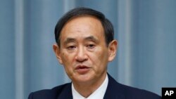 FILE - Japan's Chief Cabinet Secretary Yoshihide Suga.