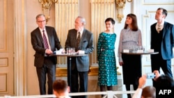 Members of the Nobel Committee for Literature, Chairman Anders Olsson, Per Wastberg, Rebecka Karde, Mikaela Blomqvist and Henrik Petersen announce the winners of the 2018 and 2019 Nobel Prize in Literature at the Swedish Academy in Stockholm, Oct. 10