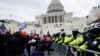 U.S. President Donald Trump&#39;s supporters try to break through a police barrier at the Capitol in Washington, D.C. as Congress prepares to affirm President-elect Joe Biden&#39;s victory.