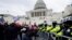 U.S. President Donald Trump&#39;s supporters try to break through a police barrier at the Capitol in Washington, D.C. as Congress prepares to affirm President-elect Joe Biden&#39;s victory.