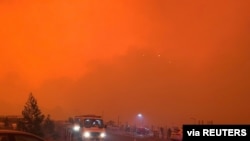 The sky glows red as bushfires continue to rage in Mallacoota, Victoria, Australia, December 31, 2019, in this photo obtained from social media. Jonty Smith from Melbourne/via REUTERS ATTENTION EDITORS - THIS IMAGE HAS BEEN SUPPLIED BY A THIRD PARTY…