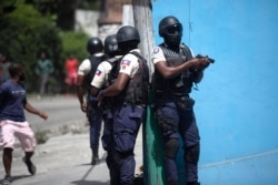 Police officers patrol in search for suspects in the murder Haiti's President Jovenel Moise, in Port-au-Prince, Haiti, July 8, 2021.