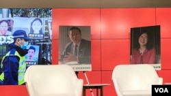 对华援助协会12月7日在美国首都华盛顿主办人权特别研讨会暨林昭自由奖颁奖仪式会场。背景上是高智晟和张展的头像。（美国之音，2021年12月7日）