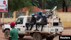 FILE - United Nations peacekeepers ride a pickup truck while on patrol in Bangui, Central African Republic, April 24, 2017. U.N. officials estimate fighting in the country has killed thousands and displaced more than a million people.