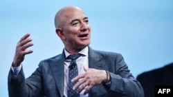 FILE - In this photograph taken Oct. 22, 2019, Blue Origin founder Jeff Bezos speaks in Washington, DC. 