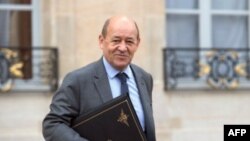 FILE - French Defense Minister Jean-Yves Le Drian at Elysee presidential Palace, Feb. 6, 2013.