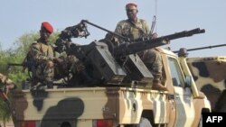 FILE - A convoy of Cameroon's army soldiers as part of a reinforcement of its military forces against Nigerian Islamist group Boko Haram.