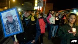 A group of about 20 people held a candlelight celebration for Robert Finicum, who was killed during an arrest Tuesday near the Malheur National Wildlife Refuge, in Burns, Ore., Jan. 27, 2016.